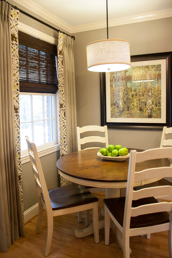 Small transitional light wood floor and brown floor kitchen/dining room combo photo with beige walls and no fireplace