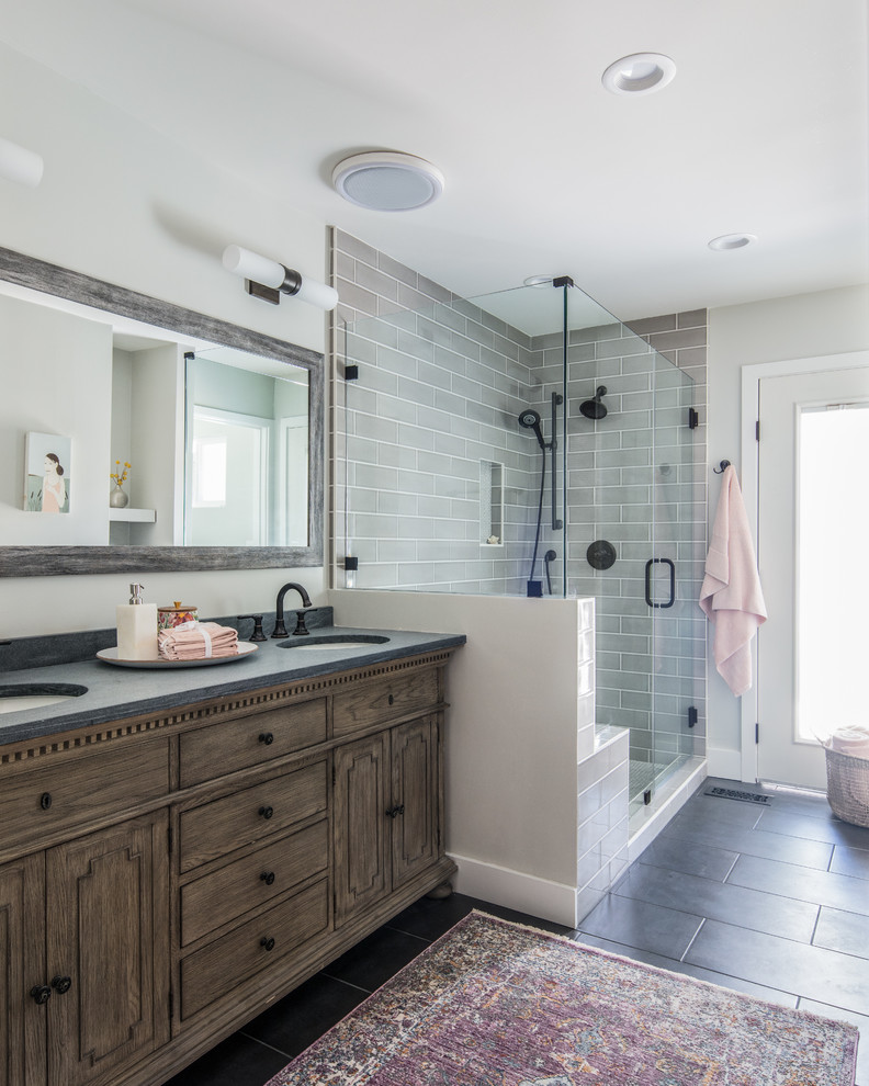 Country bathroom in San Francisco with dark wood cabinets, grey walls, an undermount sink, grey floor, grey benchtops and recessed-panel cabinets.