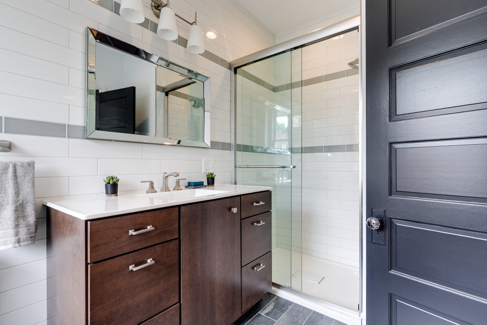 Photo of a mid-sized transitional master bathroom in Richmond with flat-panel cabinets, a curbless shower, white tile, ceramic tile, light hardwood floors, engineered quartz benchtops, a sliding shower screen, a single vanity and a freestanding vanity.
