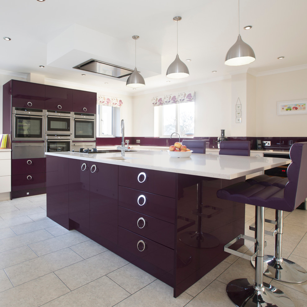 This is an example of a large contemporary kitchen in Other with an integrated sink, flat-panel cabinets, quartzite benchtops, glass tile splashback, stainless steel appliances, vinyl floors and with island.