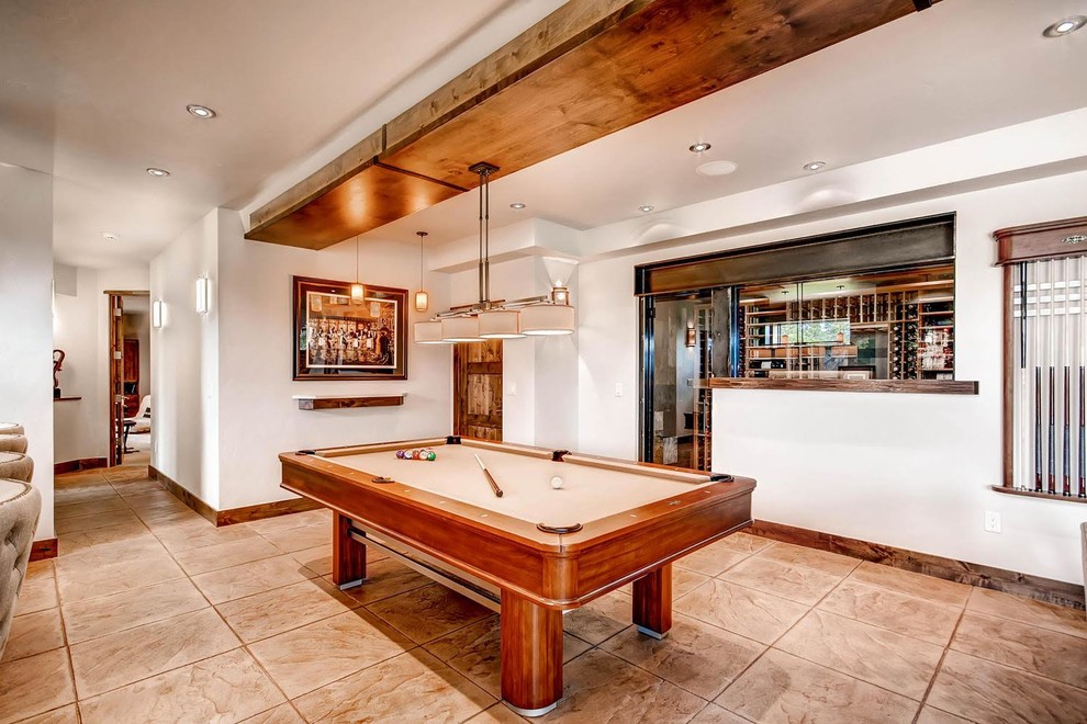 Example of a large transitional ceramic tile and beige floor family room design in Denver with white walls and no fireplace