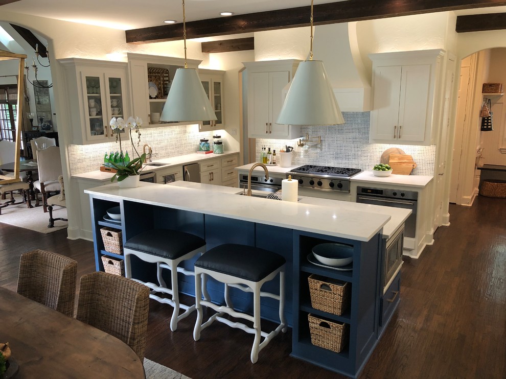 Inspiration for a large transitional u-shaped eat-in kitchen in Dallas with an undermount sink, shaker cabinets, blue cabinets, quartz benchtops, blue splashback, porcelain splashback, stainless steel appliances, dark hardwood floors, with island, brown floor and white benchtop.