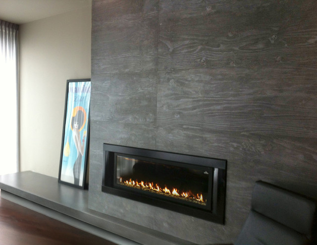 This is a foundation panel concrete fireplace surround cast by Trueform concrete for a NYC residence. The concrete picks up all the beautiful detail and