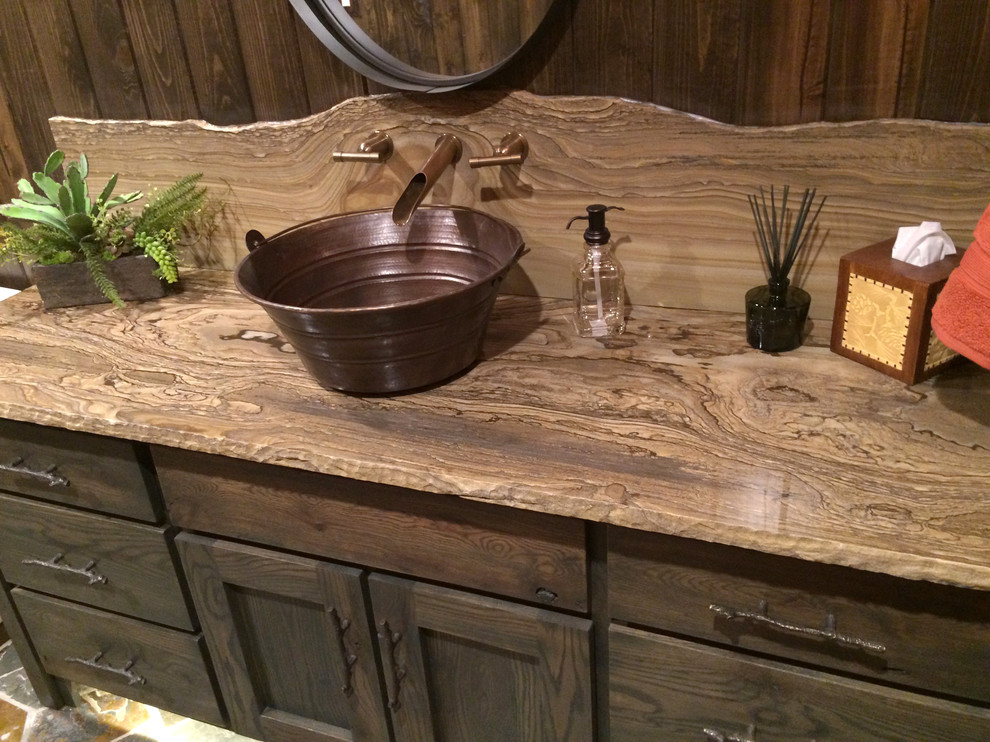 Home design - mid-sized rustic home design idea with a vessel sink, green cabinets, quartzite countertops, a two-piece toilet, orange walls and furniture-like cabinets