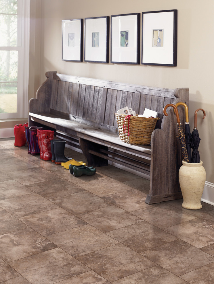 Mudroom - mid-sized rustic travertine floor and brown floor mudroom idea with beige walls