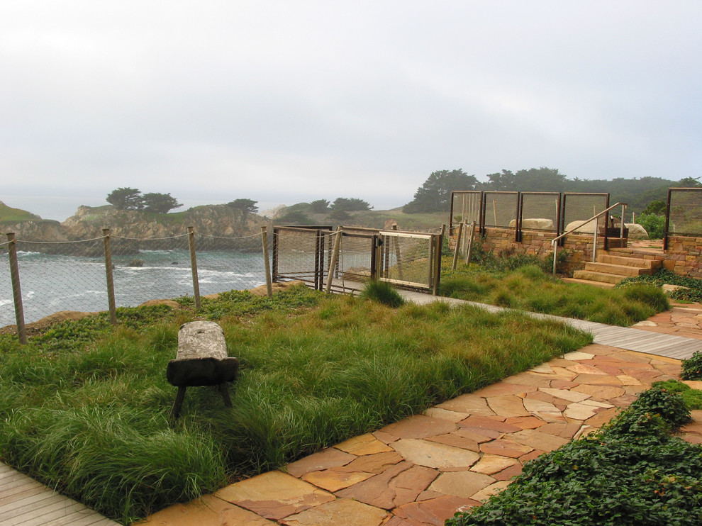 Photo of a country backyard garden in San Francisco with natural stone pavers.