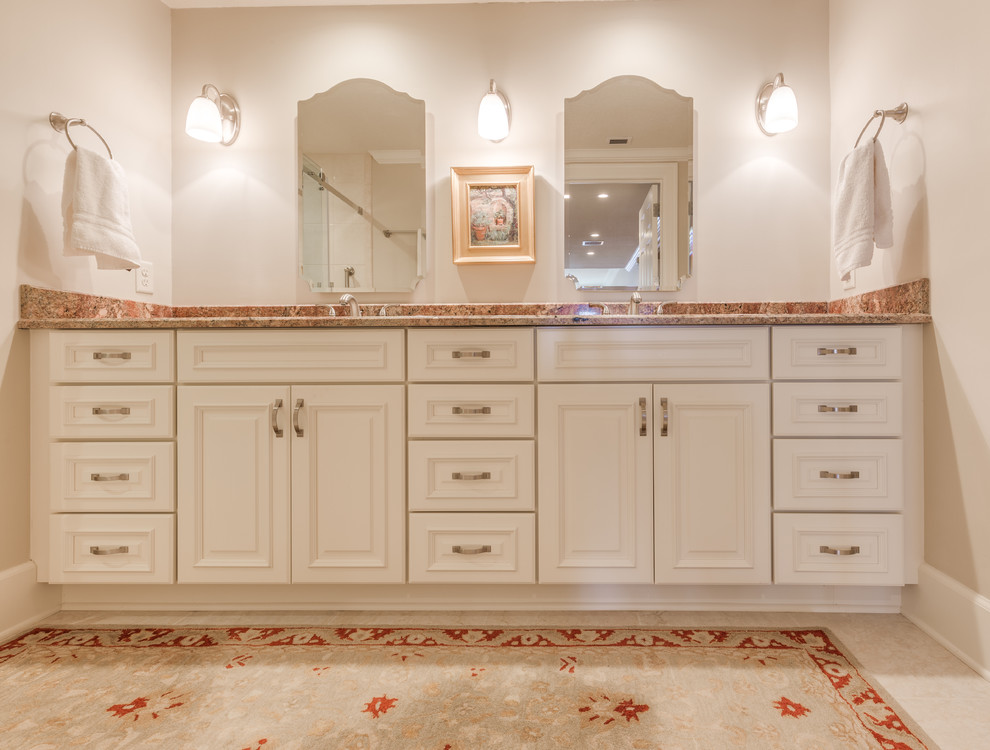 This is an example of a small bathroom in Jacksonville with raised-panel cabinets, white cabinets, an alcove shower, an urinal, beige tile, ceramic tile, beige walls, ceramic floors, engineered quartz benchtops, beige floor, a sliding shower screen and beige benchtops.