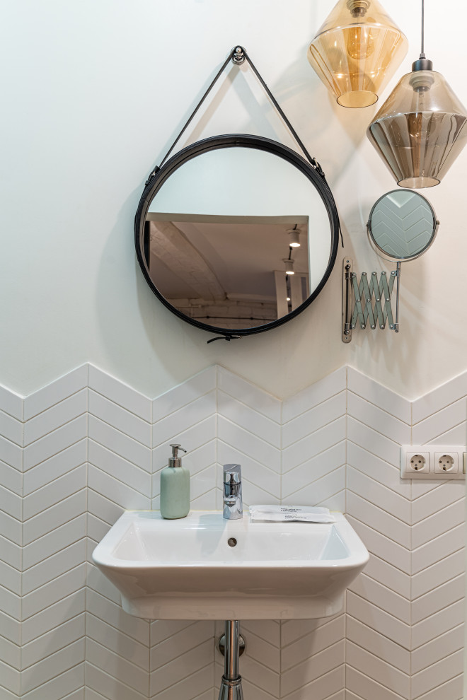 Design ideas for a medium sized scandi cloakroom in Saint Petersburg with white tiles, white walls, a wall-mounted sink and feature lighting.