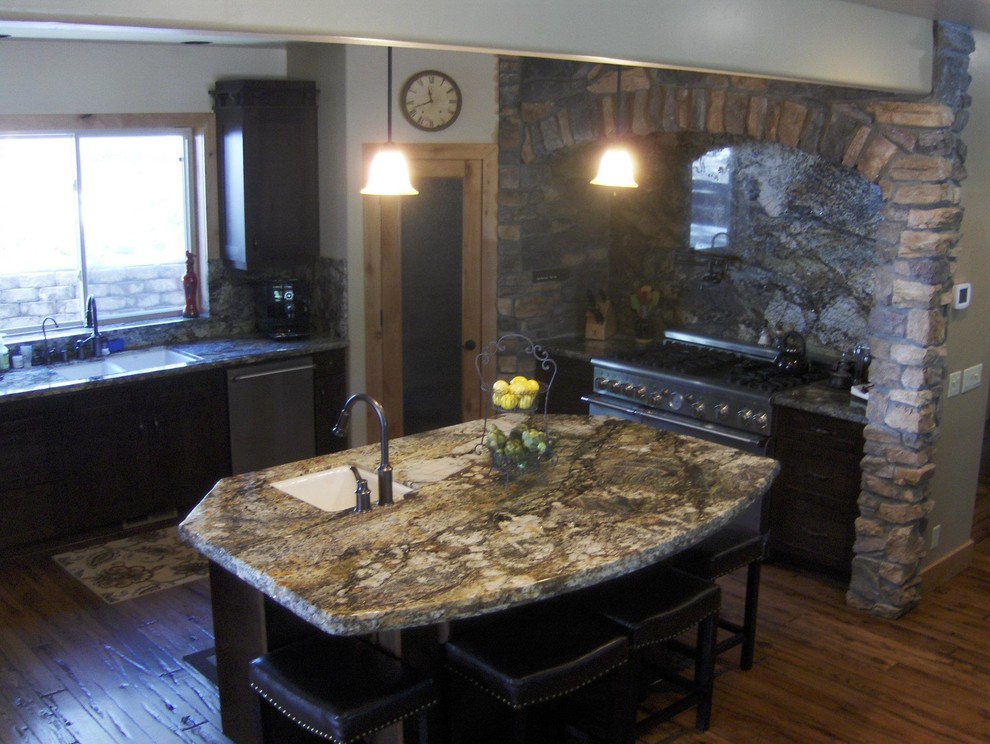 Example of a medium tone wood floor kitchen design with raised-panel cabinets, white cabinets, granite countertops, cement tile backsplash and an island