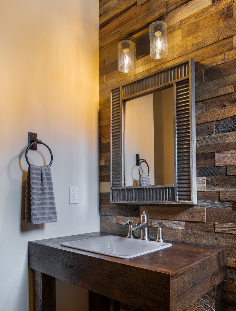 Small country bathroom in Seattle with dark wood cabinets, beige walls, a drop-in sink, wood benchtops, a single vanity, a freestanding vanity and wood walls.