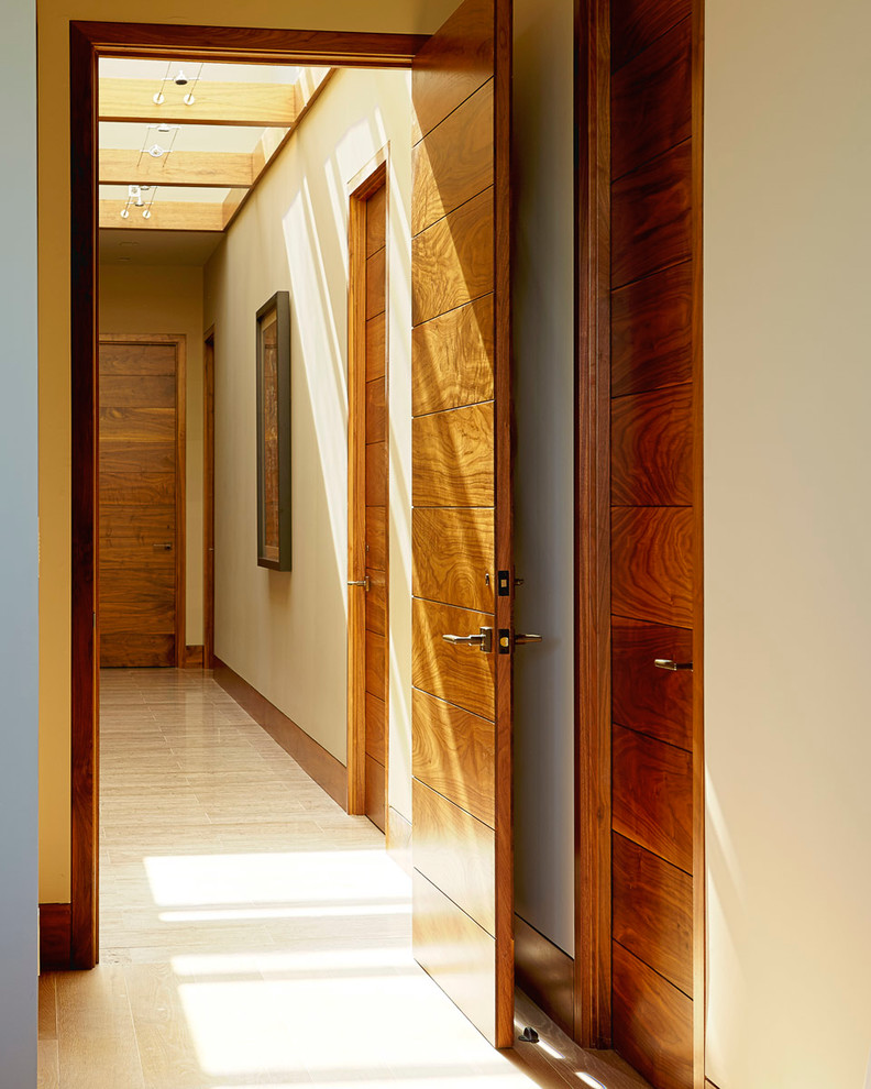 Large minimalist light wood floor hallway photo in San Francisco with white walls