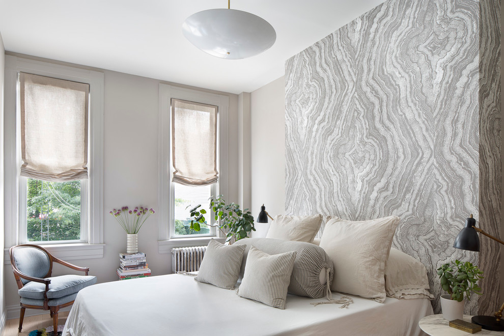 Design ideas for a mid-sized transitional master bedroom in New York with beige walls.