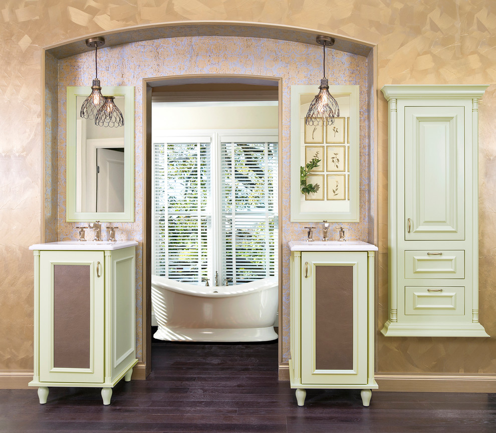 Inspiration for a large traditional master bathroom in Tampa with recessed-panel cabinets, green cabinets, a freestanding tub, multi-coloured walls, dark hardwood floors, brown floor and white benchtops.