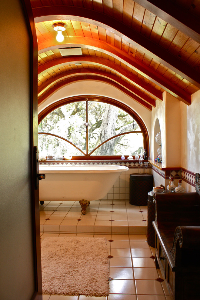 Design ideas for an eclectic bathroom in Santa Barbara with a claw-foot tub.