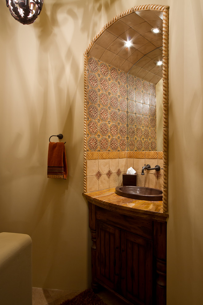 Bathroom - rustic bathroom idea in Phoenix with a vessel sink, furniture-like cabinets, dark wood cabinets and granite countertops