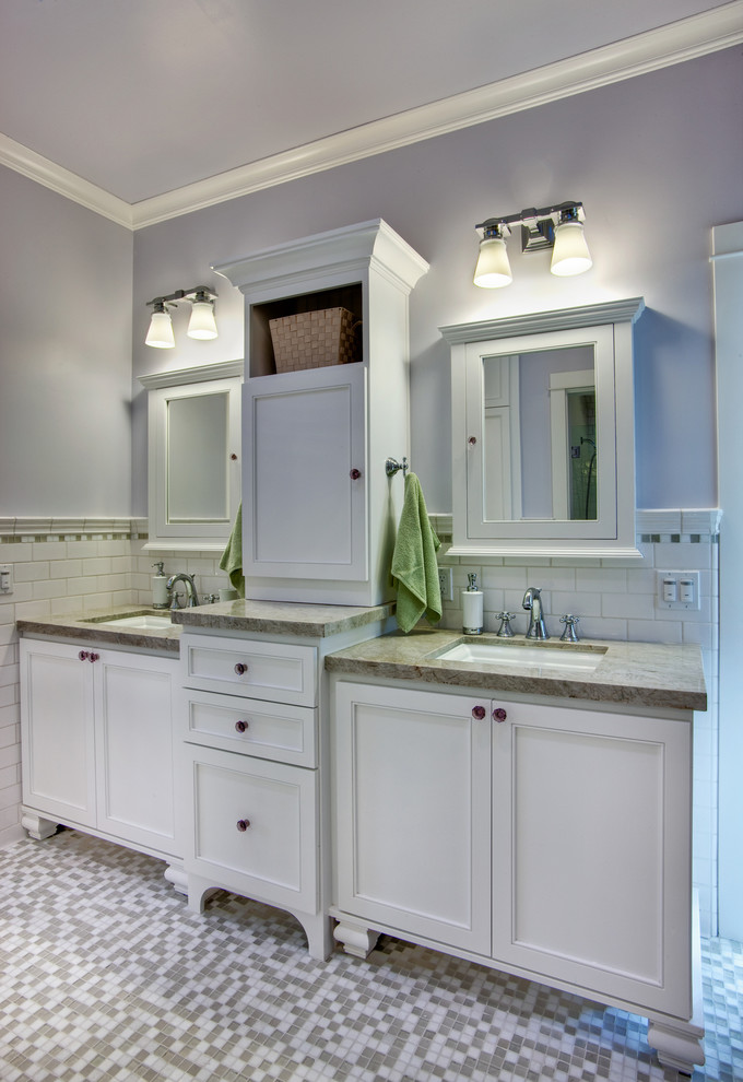 Photo of a traditional bathroom in San Diego with an undermount sink, raised-panel cabinets, white cabinets, marble benchtops, white tile, subway tile, purple walls and mosaic tile floors.