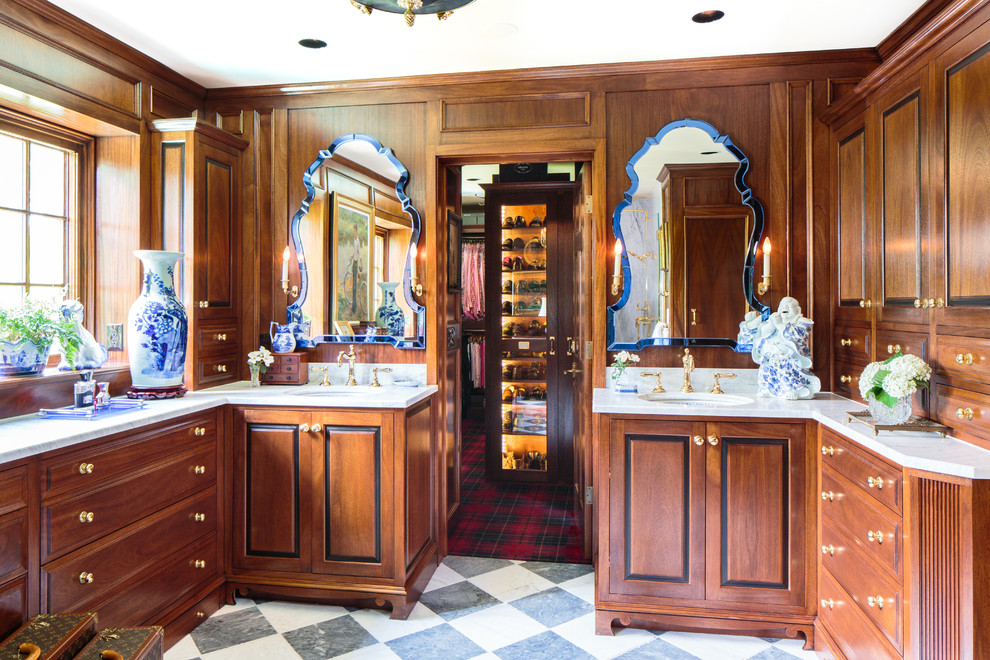 Expansive traditional master bathroom in Nashville with an alcove shower, white tile, stone slab, brown walls, ceramic floors, furniture-like cabinets, medium wood cabinets, an undermount sink and marble benchtops.