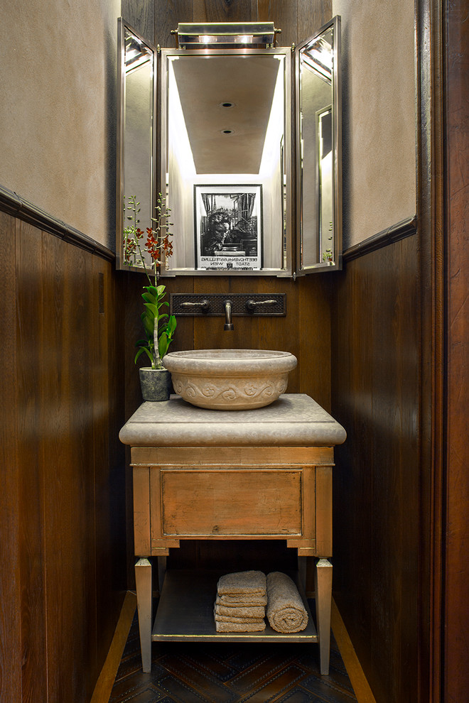 This is an example of a transitional powder room in Denver with a vessel sink and furniture-like cabinets.