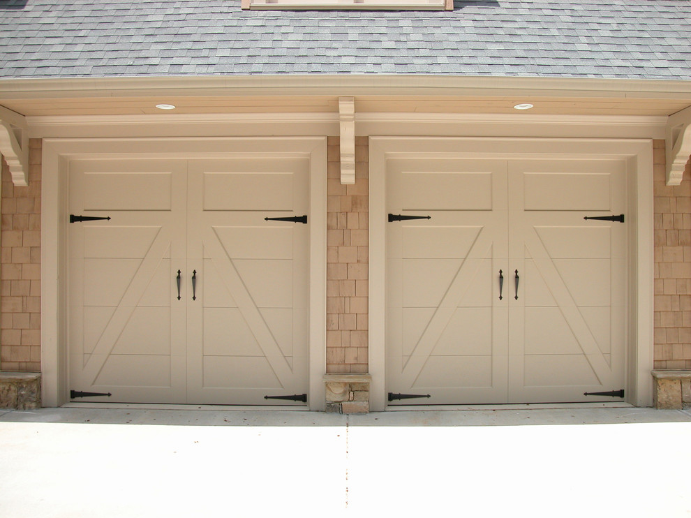 This is an example of a mid-sized traditional attached two-car garage in Los Angeles.