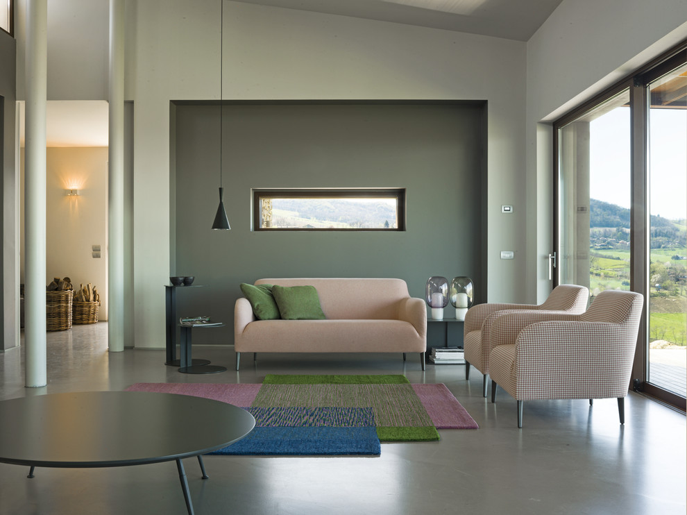 This is an example of a mid-sized contemporary formal open concept living room in Cologne with multi-coloured walls.
