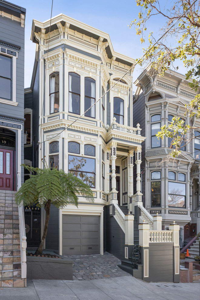Photo of a large and beige victorian two floor detached house in San Francisco with wood cladding.