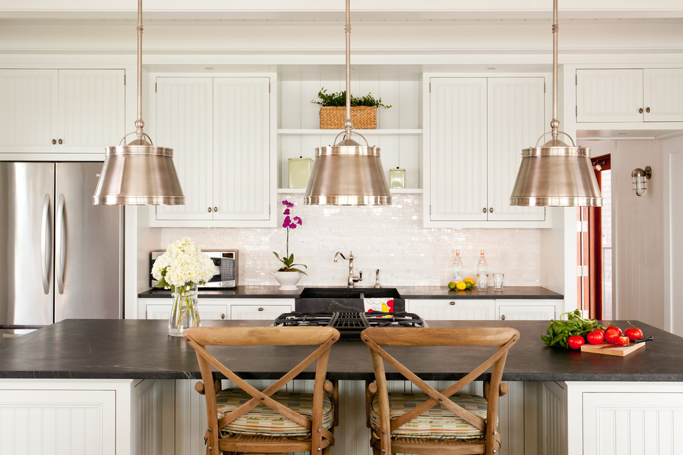 Photo of a beach style kitchen in Boston with with island.