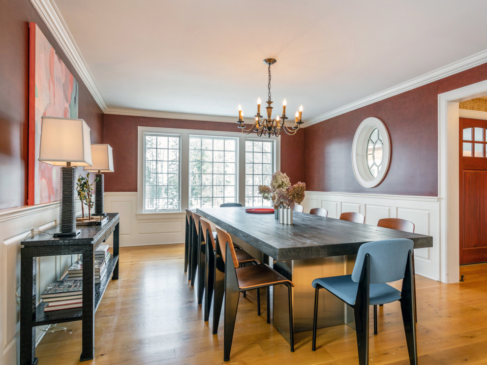 Photo of a transitional separate dining room in Bridgeport with brown walls, medium hardwood floors, brown floor, panelled walls and decorative wall panelling.
