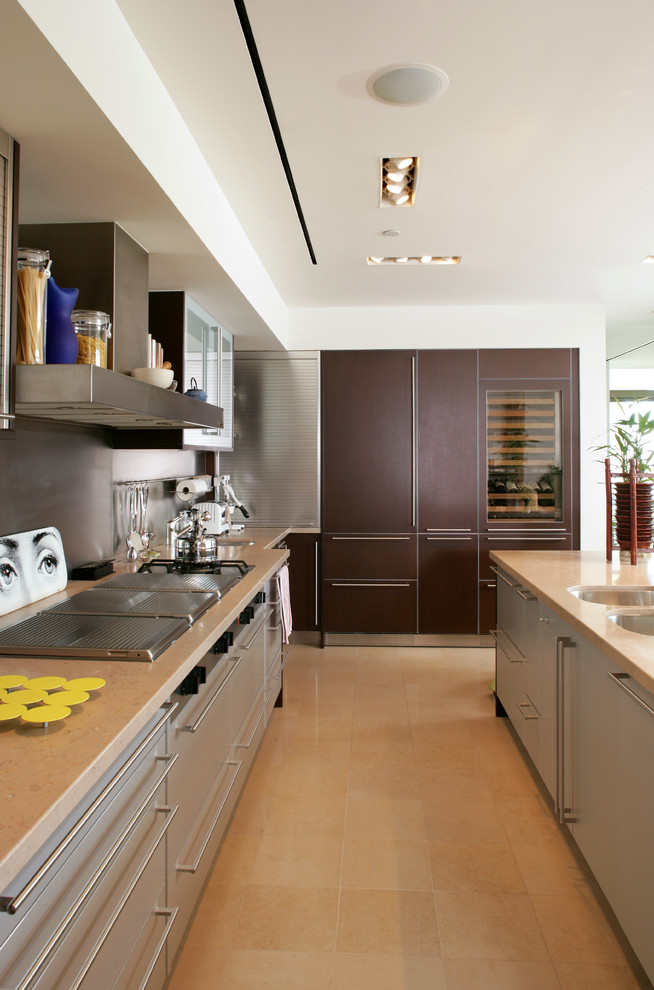 Contemporary kitchen in Las Vegas with an undermount sink, flat-panel cabinets, brown cabinets and grey splashback.