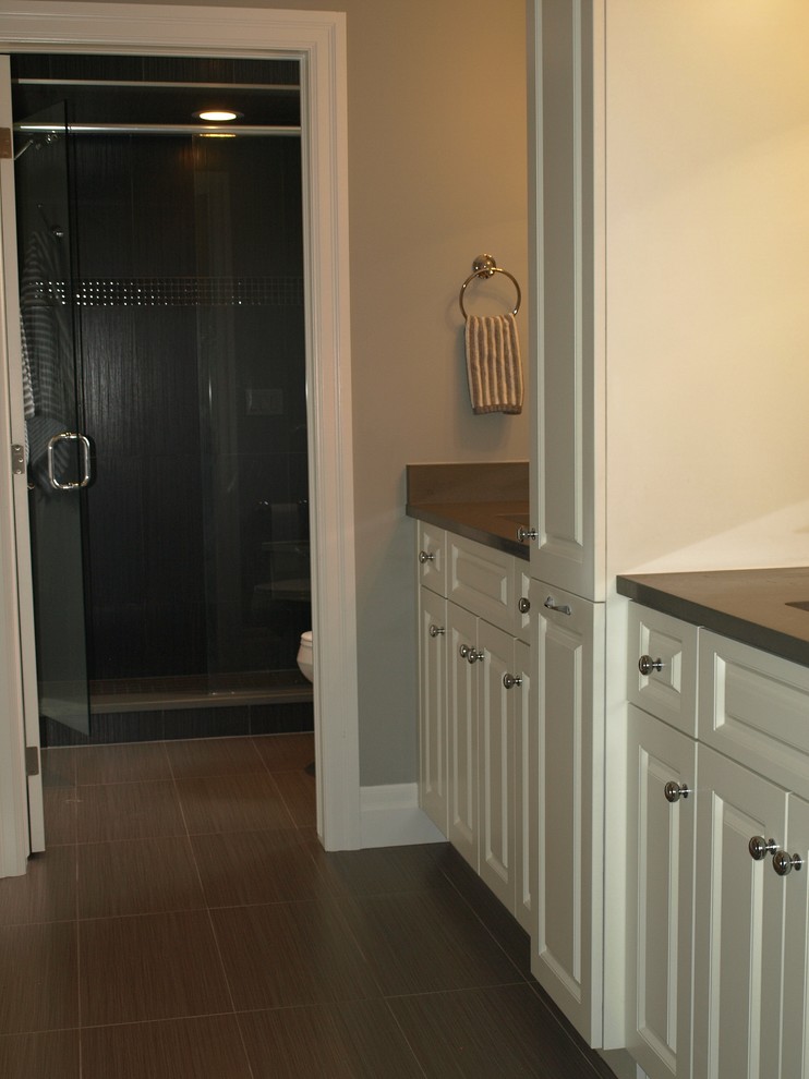 This is an example of a mid-sized contemporary 3/4 bathroom in Toronto with an undermount sink, raised-panel cabinets, white cabinets, quartzite benchtops, an open shower, gray tile, ceramic tile, grey walls and ceramic floors.