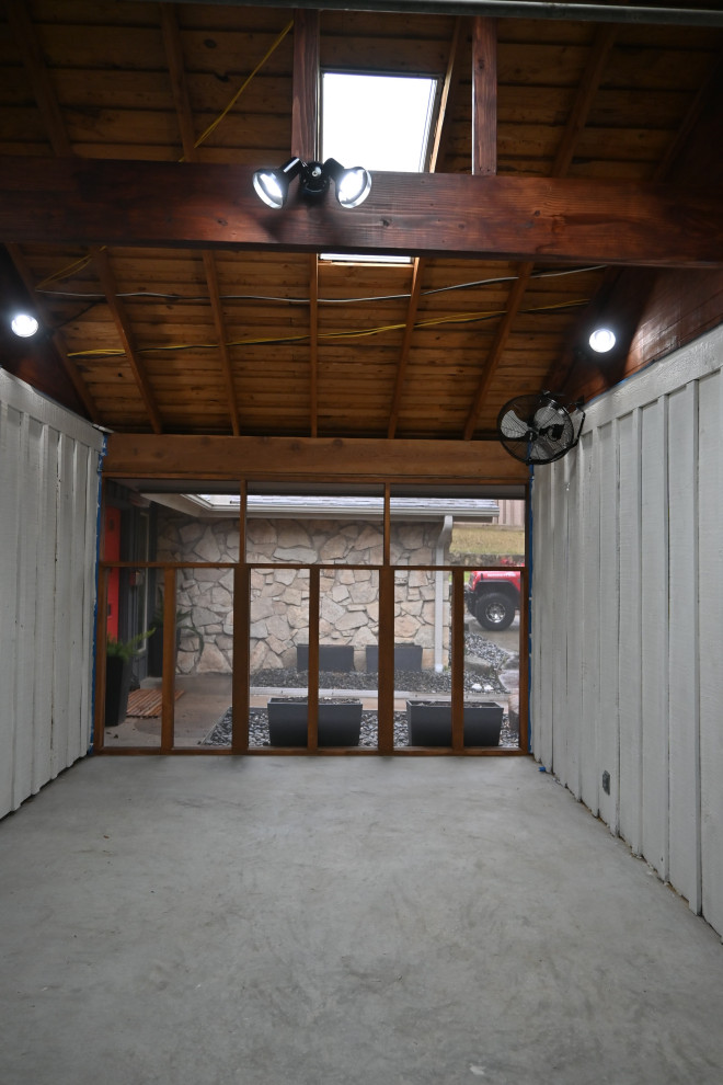 Example of a mid-sized mountain style concrete floor and gray floor sunroom design in Dallas