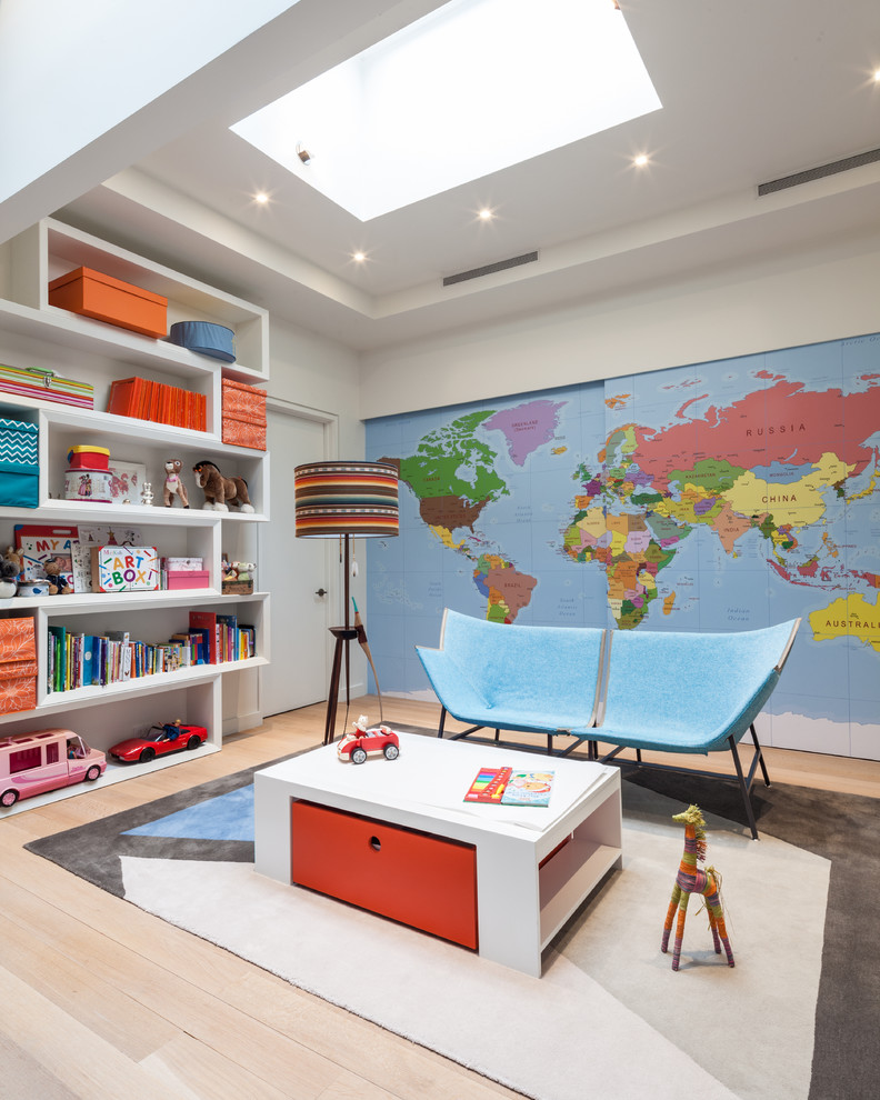 Inspiration for a contemporary gender-neutral kids' playroom in New York with light hardwood floors, beige floor and multi-coloured walls.