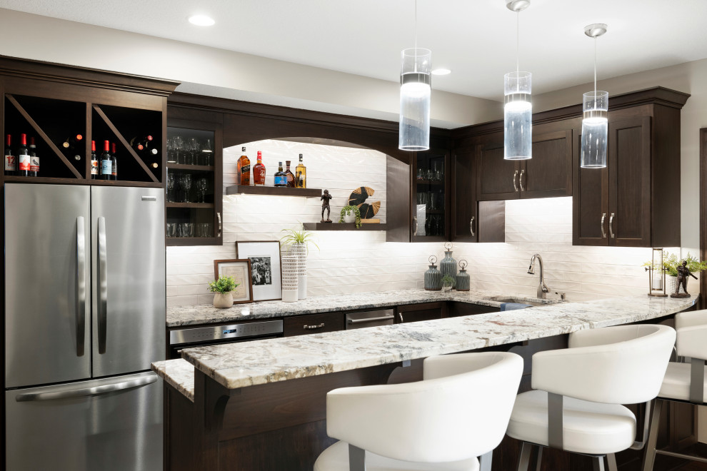 Design ideas for a large transitional u-shaped seated home bar in Minneapolis with an undermount sink, shaker cabinets, dark wood cabinets, quartz benchtops, yellow splashback, ceramic splashback, brown floor and multi-coloured benchtop.