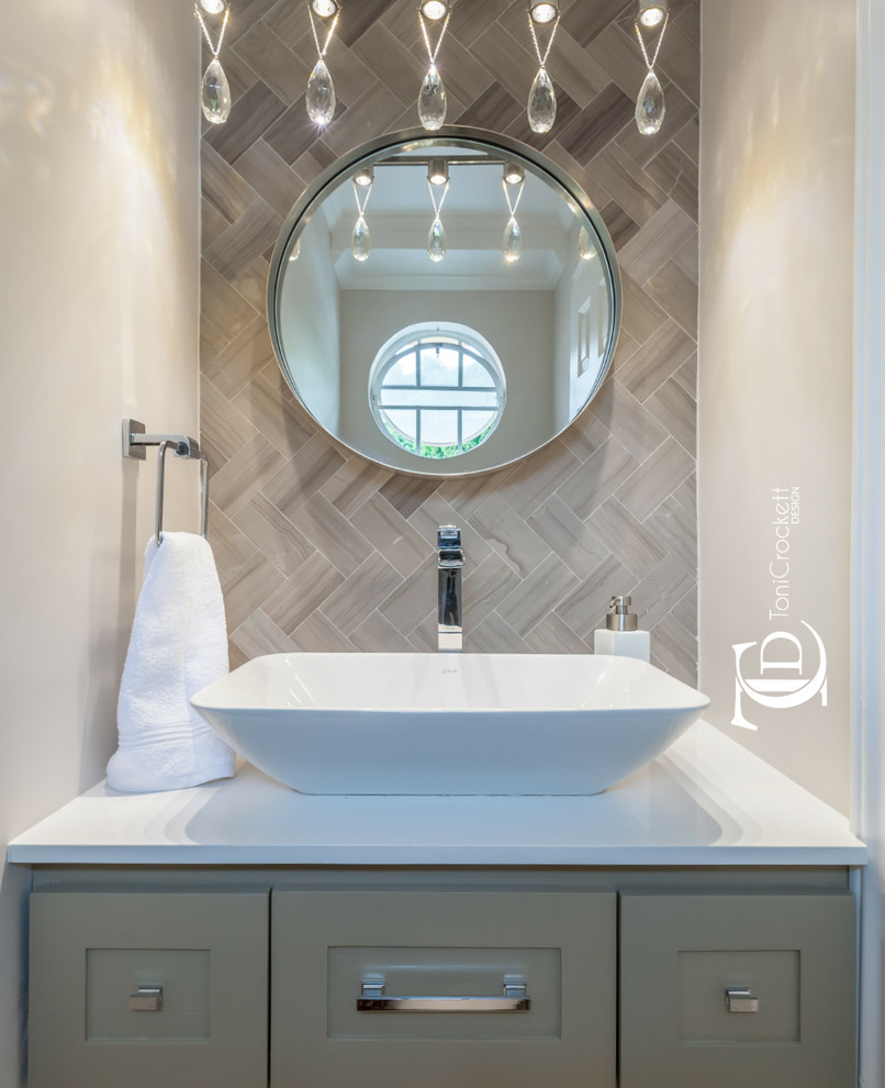This is an example of a small contemporary powder room in Other with shaker cabinets, marble, grey walls, a vessel sink and engineered quartz benchtops.