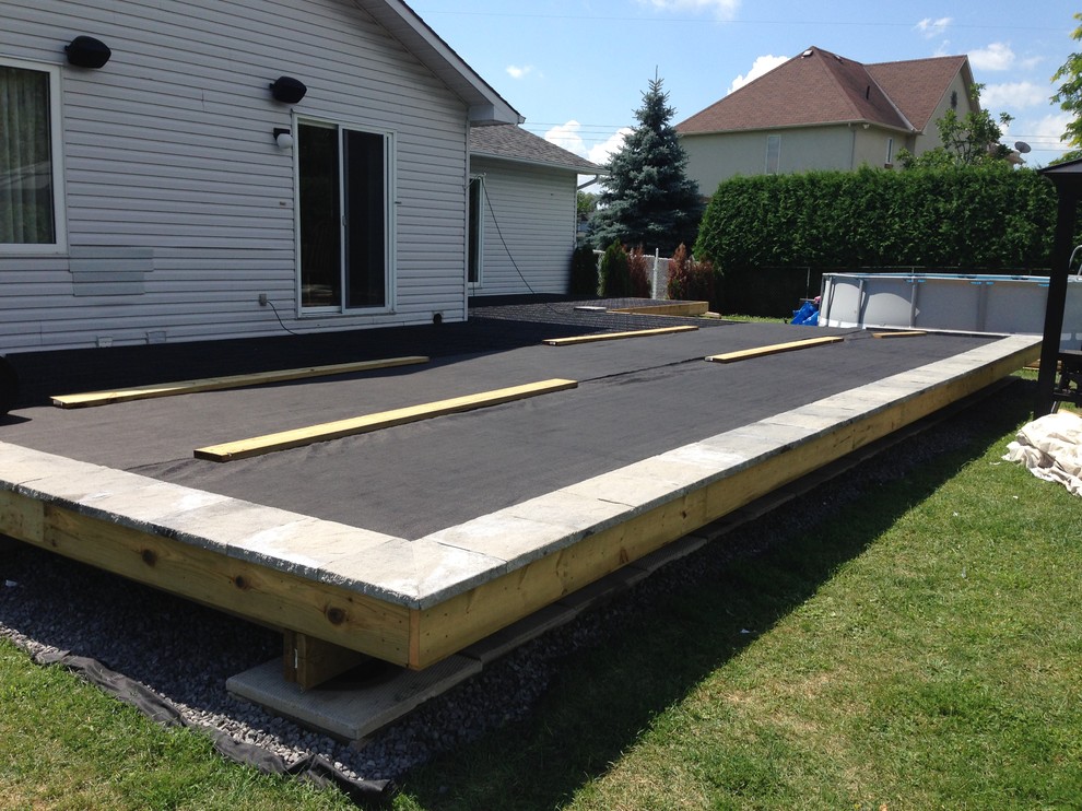 Example of a huge transitional backyard deck design