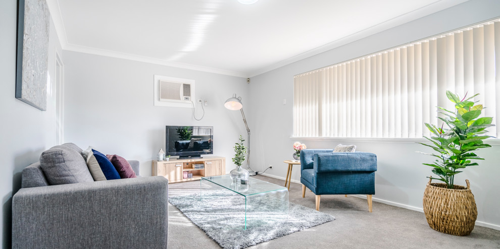 Small eclectic open concept living room in Perth with grey walls, carpet and grey floor.