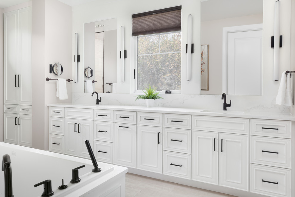 Transitional master beige floor and double-sink bathroom photo with recessed-panel cabinets, white cabinets, white walls, white countertops and a built-in vanity