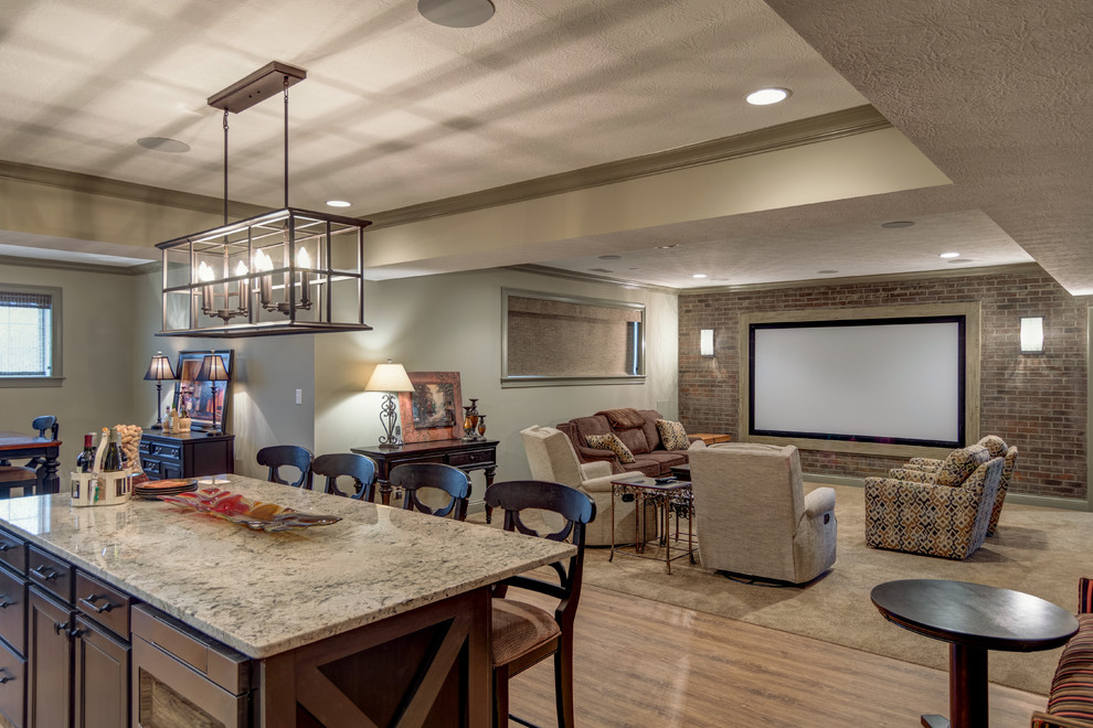 Photo of a large traditional open concept home theatre in Indianapolis with beige walls, carpet, a projector screen and beige floor.