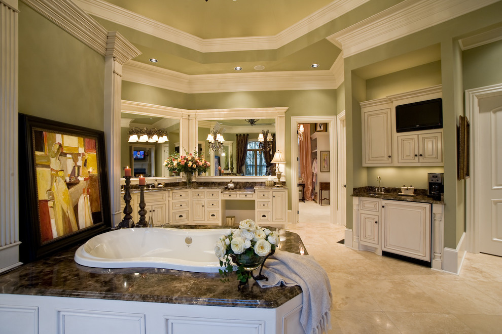Inspiration for an expansive traditional master bathroom in Nashville with raised-panel cabinets, white cabinets, a drop-in tub, green walls, porcelain floors, an undermount sink and marble benchtops.