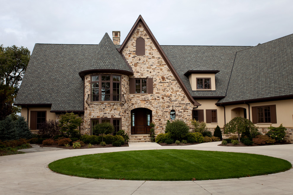 This is an example of a traditional exterior in Cleveland with stone veneer.