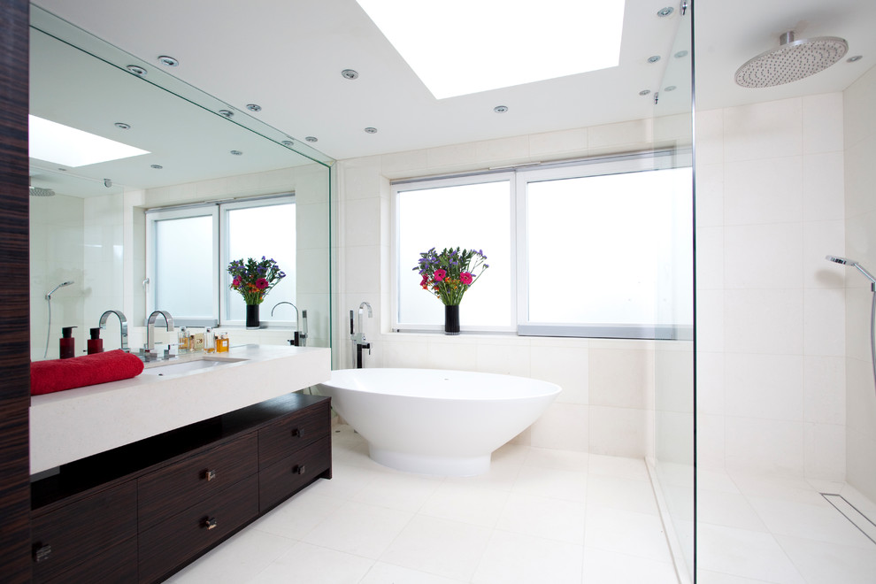 Photo of a contemporary bathroom in London with a freestanding tub.