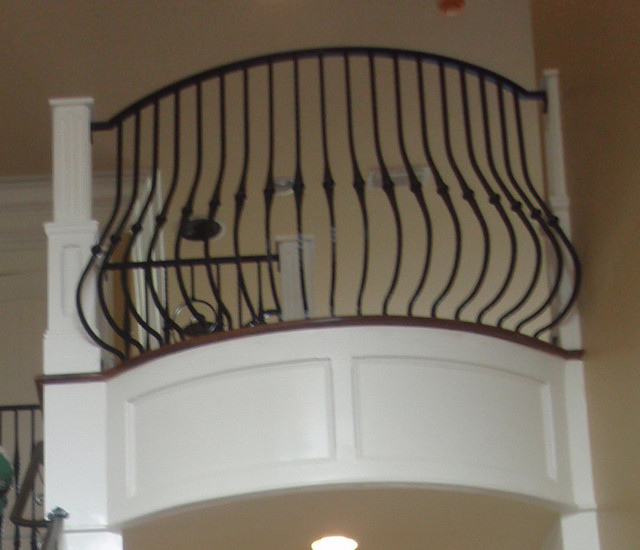 Interior curved wrought iron belly style balcony rail
