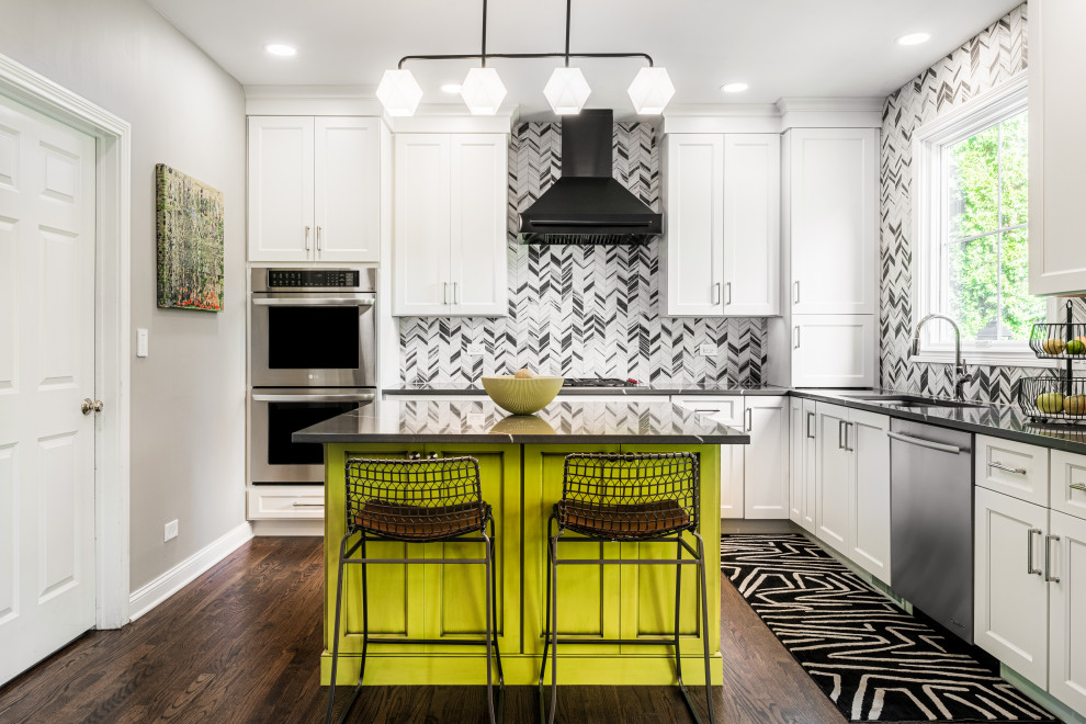 Kitchen - transitional u-shaped dark wood floor and brown floor kitchen idea in Chicago with an undermount sink, recessed-panel cabinets, white cabinets, multicolored backsplash, stainless steel appliances, an island and gray countertops