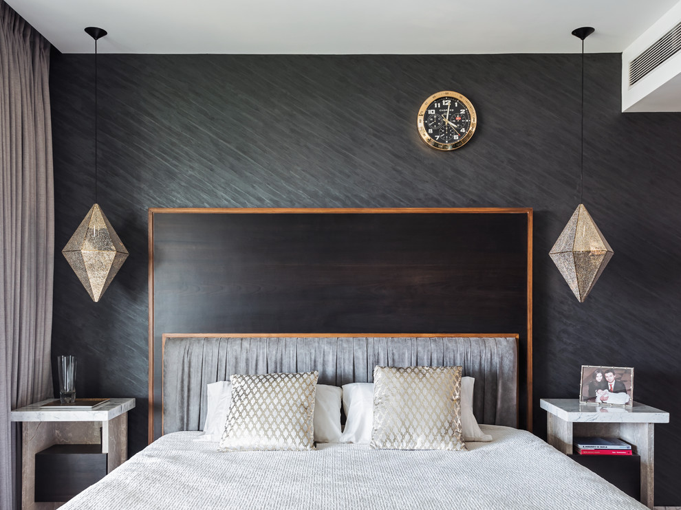 This is an example of a contemporary bedroom in Mumbai with grey walls.