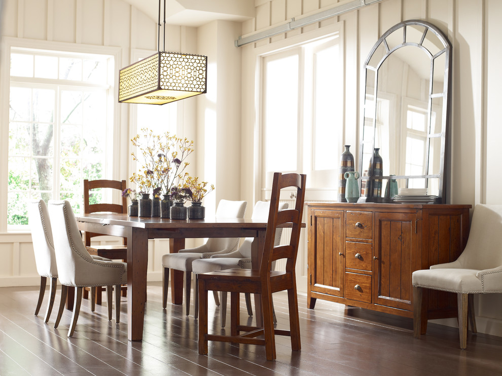 Country dining room in Atlanta with white walls and dark hardwood floors.