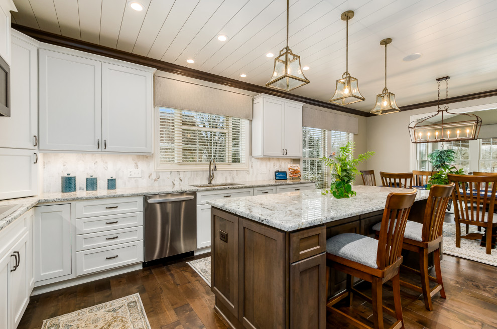 Design ideas for a large transitional u-shaped eat-in kitchen in Columbus with shaker cabinets, granite benchtops, marble splashback and with island.