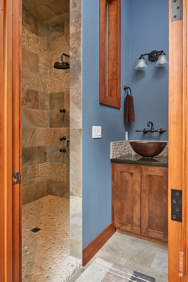 Small transitional bathroom in Seattle with shaker cabinets, brown cabinets, an alcove shower, brown tile, slate, blue walls, slate floors, with a sauna, quartzite benchtops, multi-coloured floor and black benchtops.