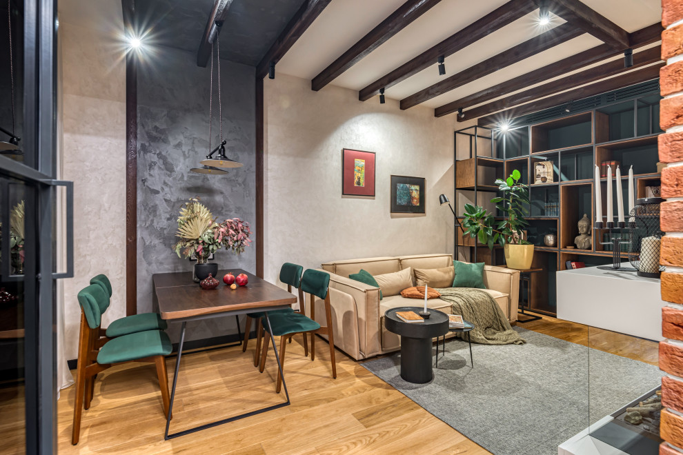 This is an example of a medium sized urban living room in Moscow with a reading nook, beige walls, medium hardwood flooring, a ribbon fireplace and a wall mounted tv.