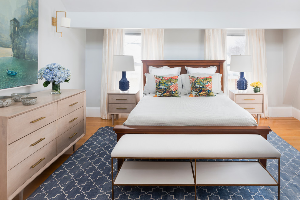 Transitional master bedroom in Boston with grey walls.