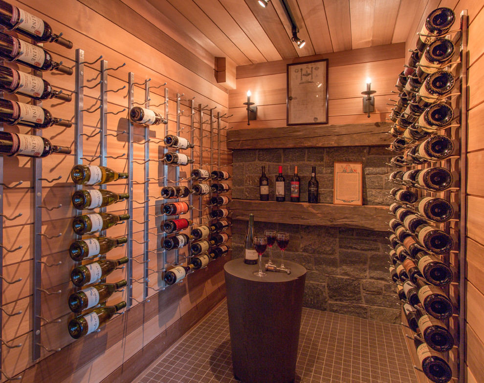 Photo of a mid-sized transitional wine cellar in Boston with storage racks.