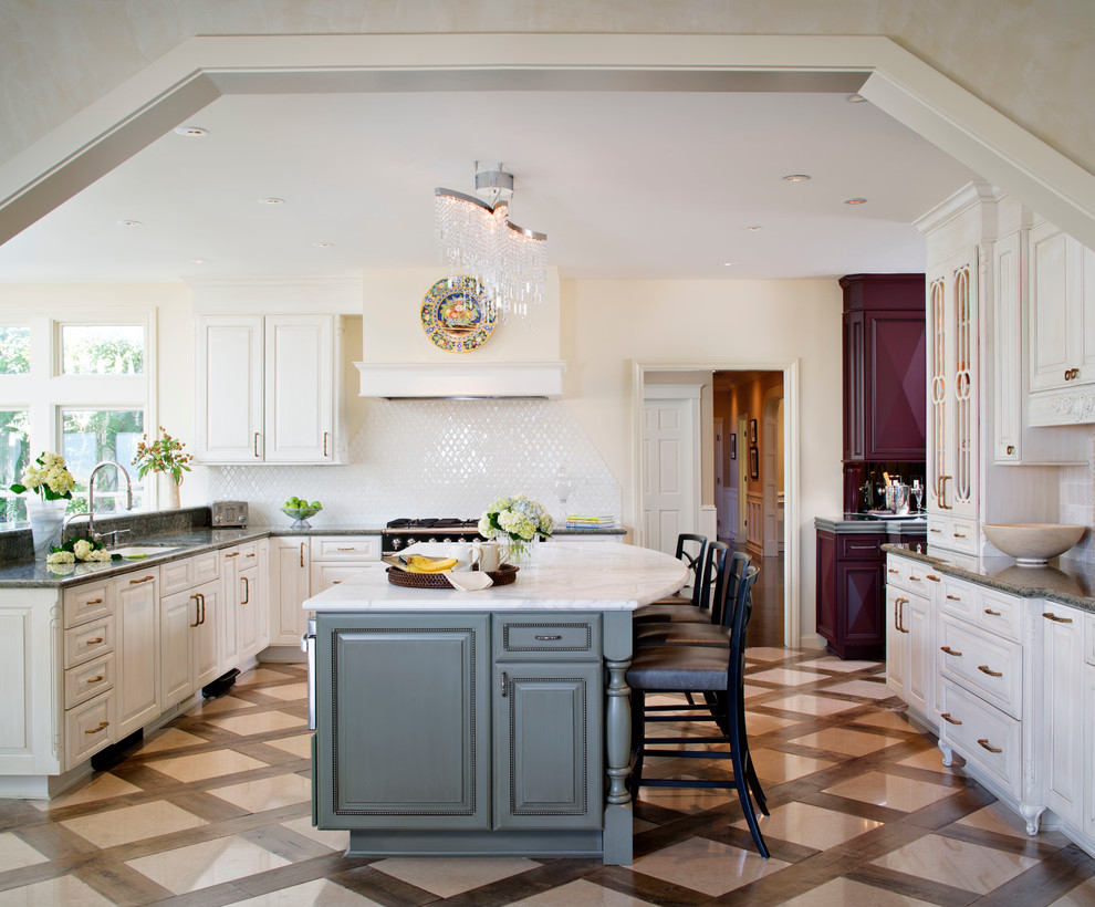 Photo of a traditional kitchen in San Francisco with white splashback and panelled appliances.